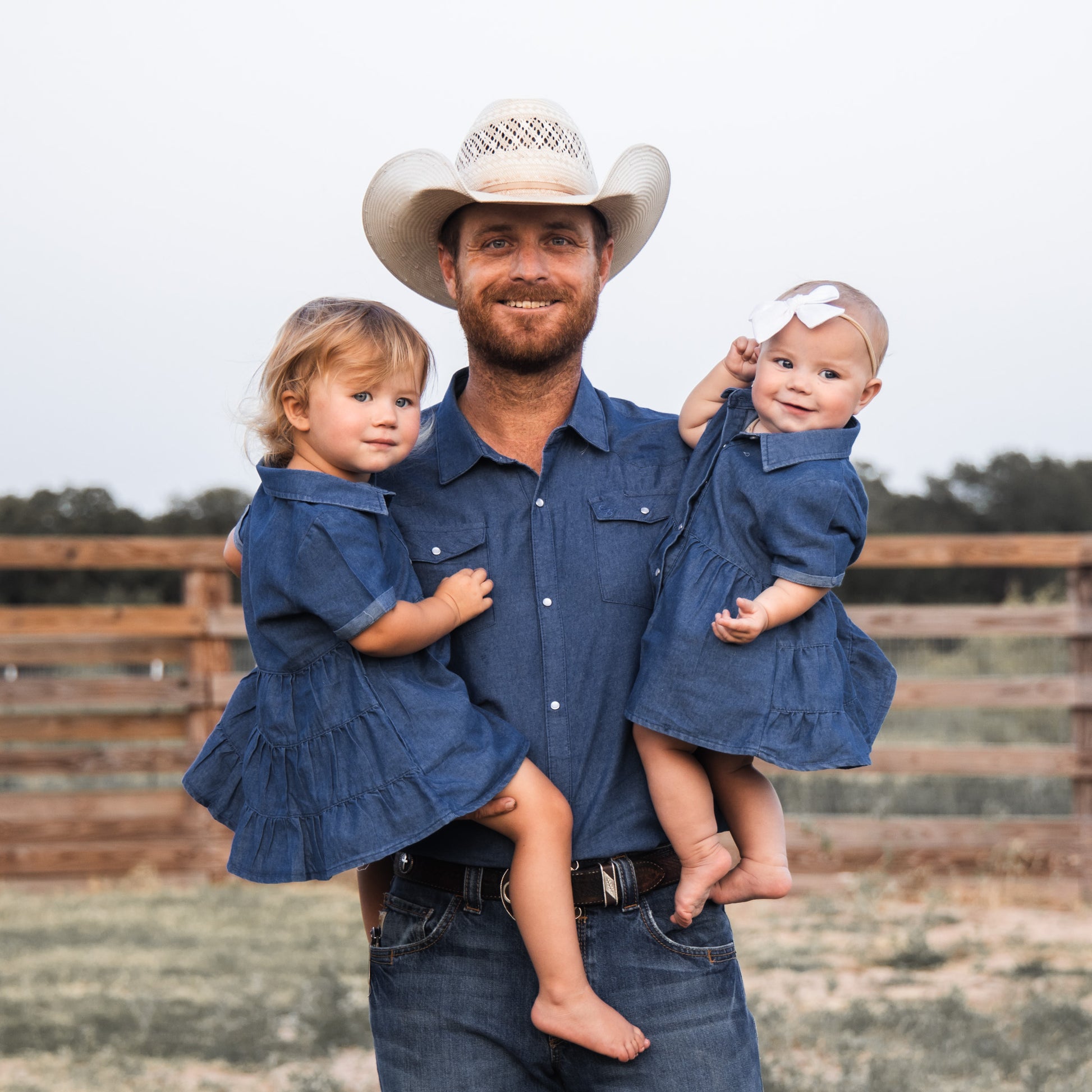 denim dress family pictures young mother with daughters dressed in denim dresses. Family look. Happy family Stock Photo